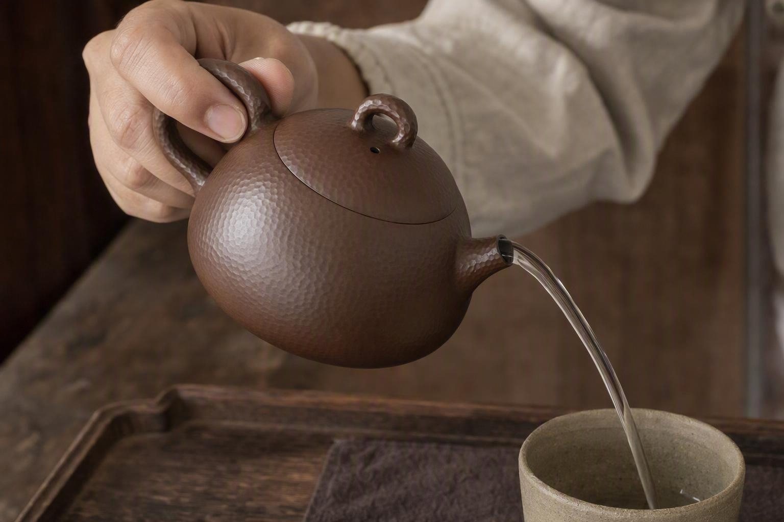 The handle and spout from the pouring side