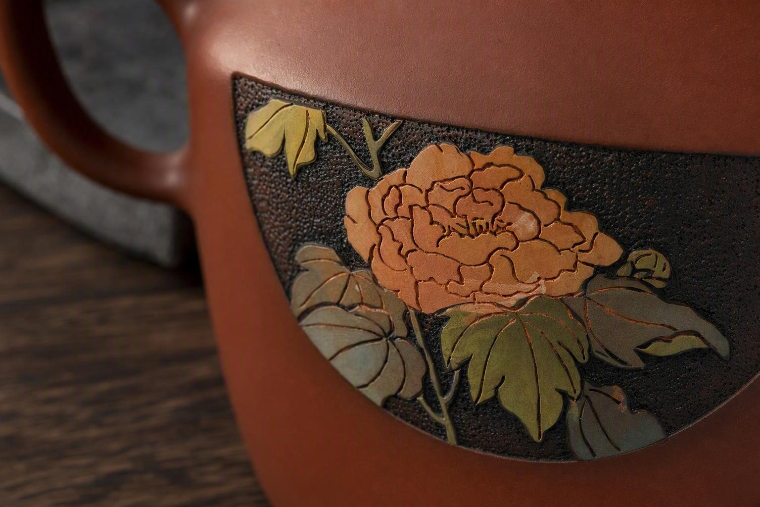 Floral Yangcai: coloured peony inside an incised dark panel