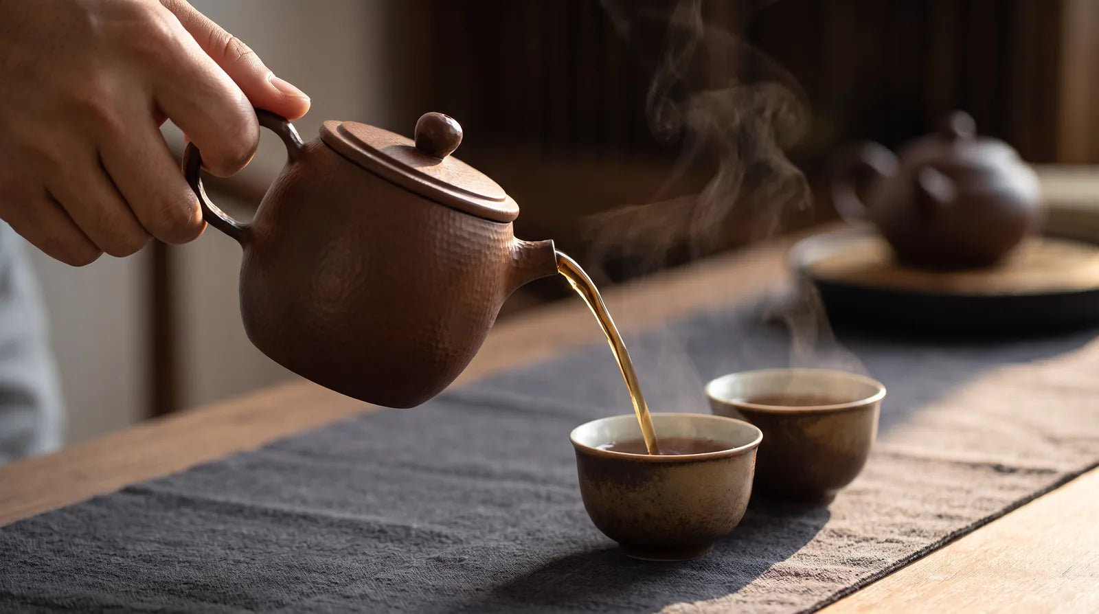 Hammered Earth No. 7: small purple-clay vessel in a tea-pouring gesture