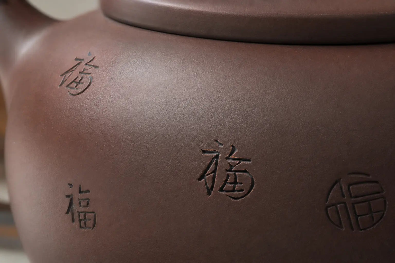 The handle and spout from the pouring side