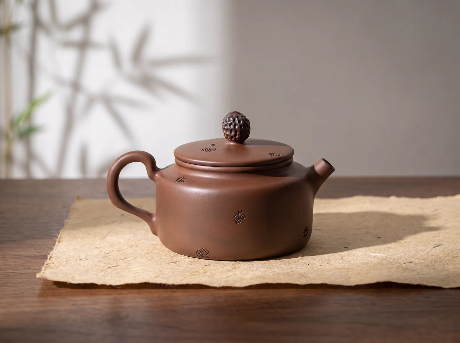 Jianshui – Hundred Blessings Teapot · No. 2 in an editorial setting