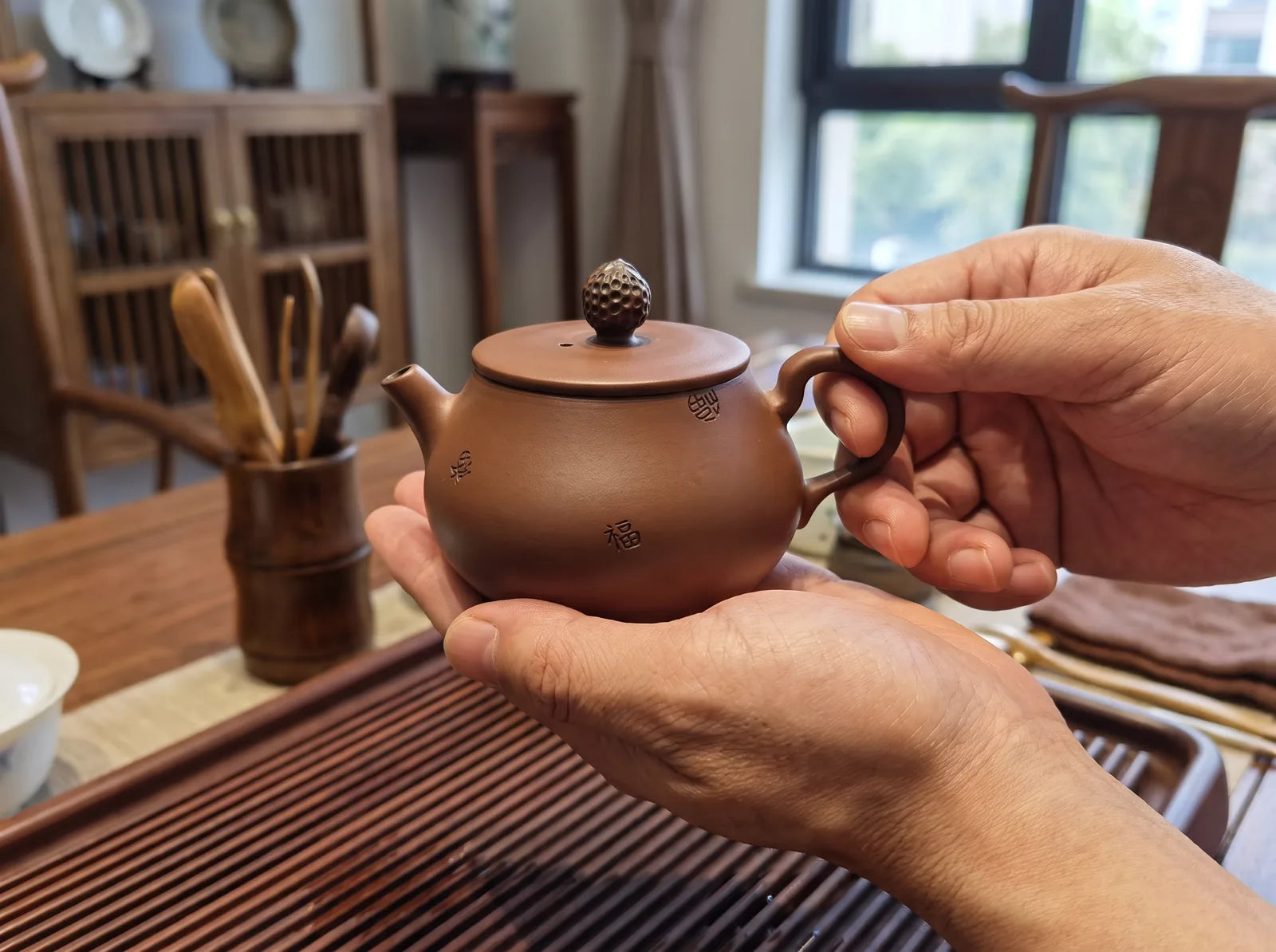 Jianshui – Hundred Blessings Teapot No.3 in an editorial setting