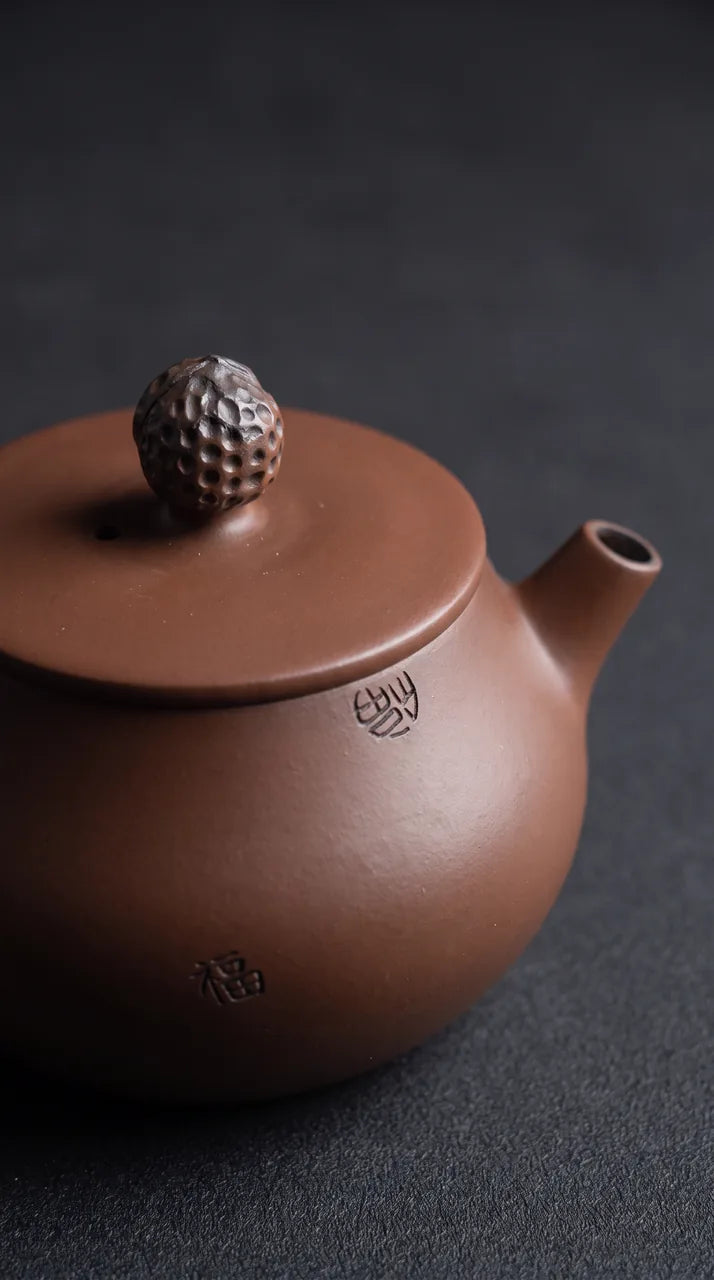 The handle and spout from the pouring side