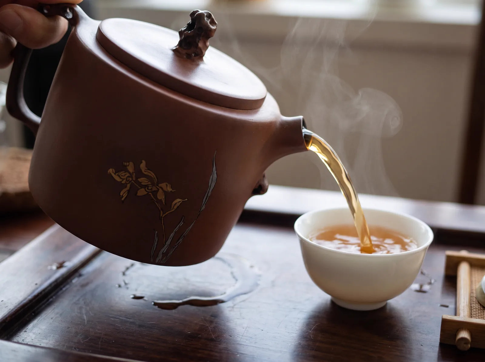 The handle and spout from the pouring side