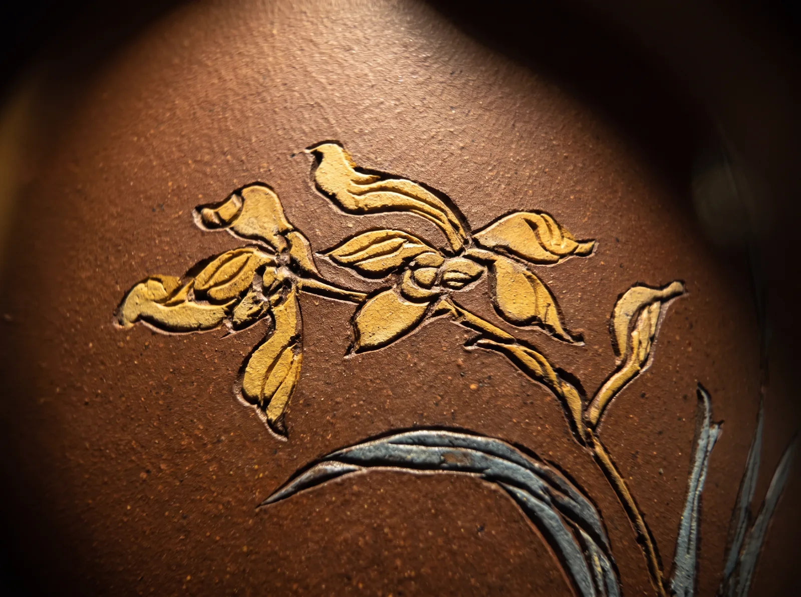 A close view of the surface decoration and clay finish