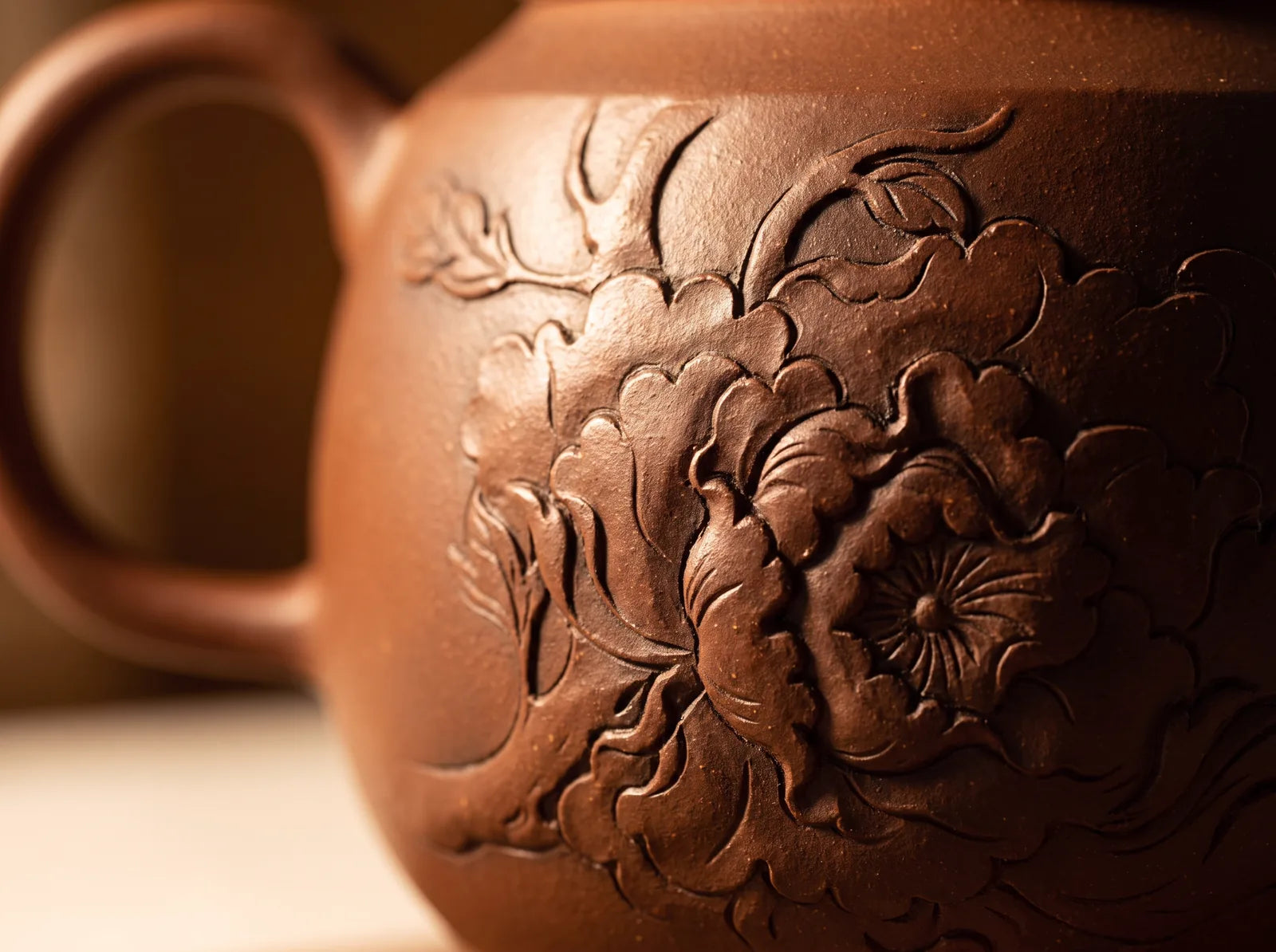 Jianshui  – Relief Teapot in an editorial setting