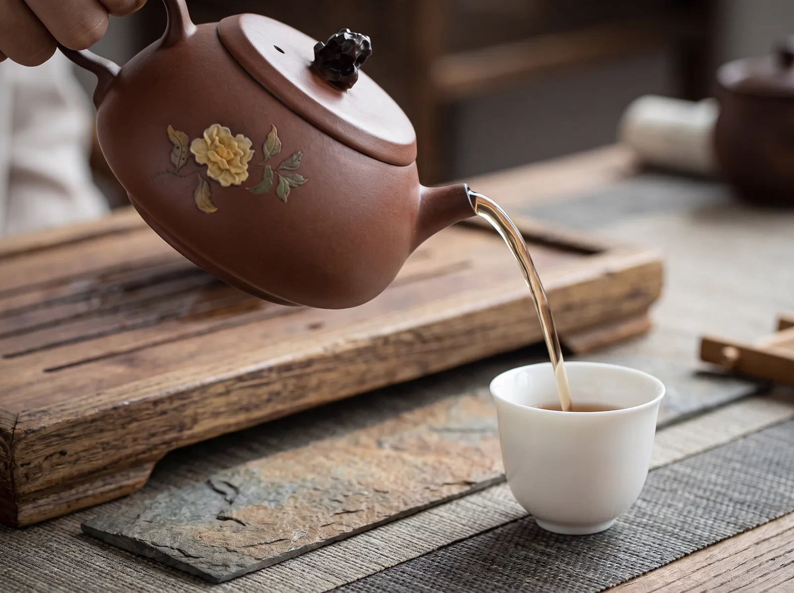 The handle and spout from the pouring side