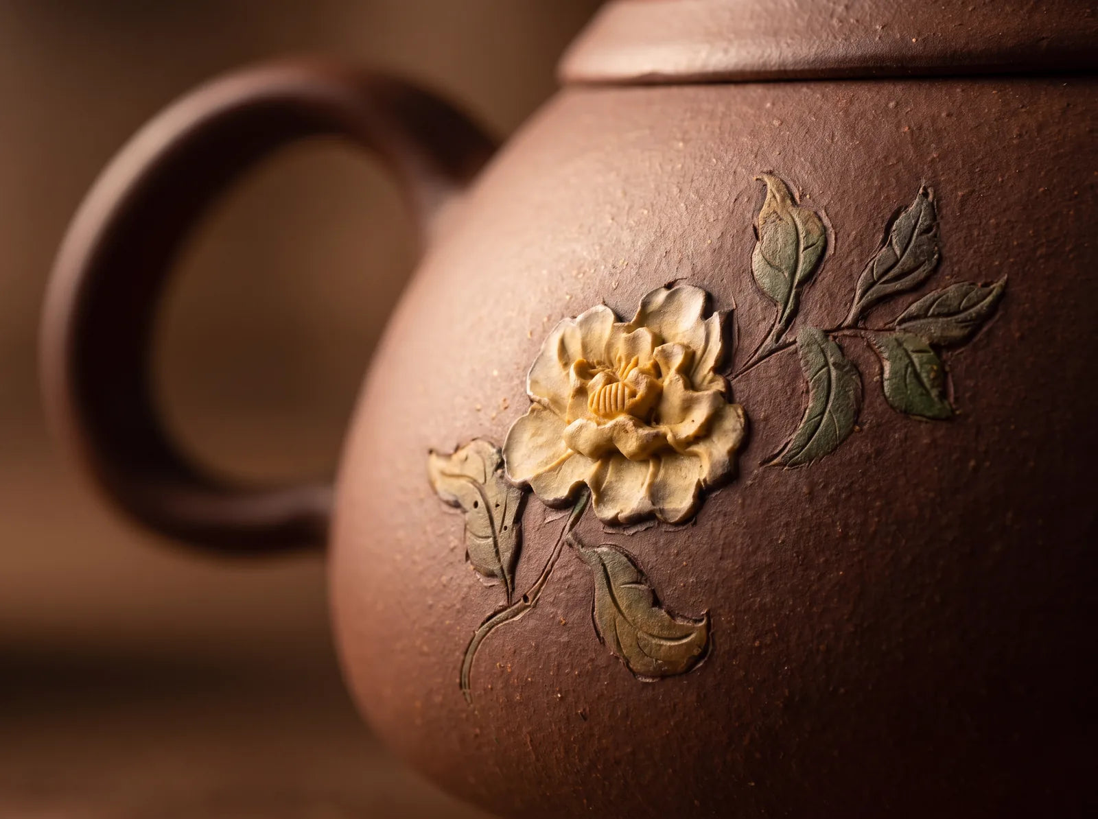 A close view of the surface decoration and clay finish